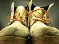 Pair of old, worn heavy boots. Royalty Free Stock Photo