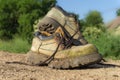 Pair of old worn hiking boots an a gravel path Royalty Free Stock Photo