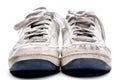 A pair of old worn sports shoes