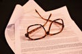 Tortoiseshell glasses on open contract Royalty Free Stock Photo