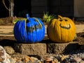 Pair of painted pumpkins smile at passerbys Royalty Free Stock Photo