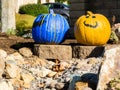 Pair of painted pumpkins greet passerbys Royalty Free Stock Photo