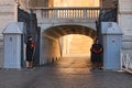 pair of Papal Swiss guards stand guard at the entrance of Saint Peter`s Basilica. Swiss Guards in their traditional uniform