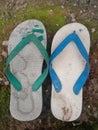 a pair of photos of sandals that look unique because they are different colors and look damaged and broke