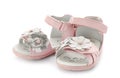 Pair of pink baby sandals decorated with flowers Royalty Free Stock Photo