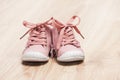 pair of pink baby shoes on the floor Royalty Free Stock Photo