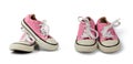 Pair of pink children`s textile sneakers with white laces isolated on a white background Royalty Free Stock Photo