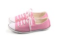 Pair of pink female sneakers isolated on white Royalty Free Stock Photo