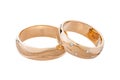 Pair of pink gold wedding rings with diamonds isolated on white background Royalty Free Stock Photo