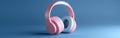 A pair of pink headphones are floating on a blue background