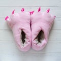 Pair of pink monster foot slippers