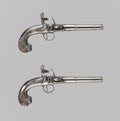 Pair of pistols or muskets on a white background