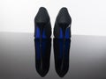 Pair of pointed woman shoes with black soles blue high heels Royalty Free Stock Photo