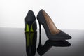 Pair of pointed woman shoes with black soles green high heels Royalty Free Stock Photo