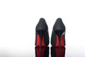 Pair of pointed woman shoes with black soles red high heels Royalty Free Stock Photo