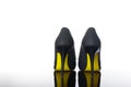 pair of pointed woman shoes with black soles yellow high heels Royalty Free Stock Photo