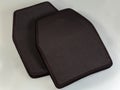 Two polyethylene armor plates for bulletproof vest on gray background Royalty Free Stock Photo