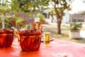 Pair of pomegranate trees in pot wrapped in red paper. On table set for ceremony to pay respect to angels of heaven and earth Royalty Free Stock Photo