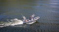 Pair of Portuguese maritime police officers on high speed RIB on the River Duoro near Porto, Portugal