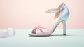 a pair of pristine white high heel bridal shoes on a white surface for a minimalistic, elegant composition that embodies