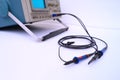 A pair of probes connected to an oscilloscope. Royalty Free Stock Photo