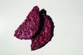 Pair of purple dried dragon fruit chips
