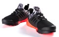 Pair of red and black sporty shoes for kid on white Royalty Free Stock Photo