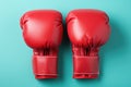 A pair of red boxing gloves on a blue background. Generative AI image. Royalty Free Stock Photo