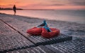 A pair of red childrens shoes left behind at the beach Royalty Free Stock Photo