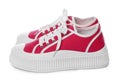 Pair of red classic old school sneakers on white background Royalty Free Stock Photo
