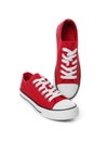 Pair of red classic old school sneakers on white background Royalty Free Stock Photo