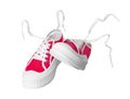 Pair of red classic old school sneakers on white background Royalty Free Stock Photo