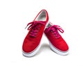 A pair of red color canvas shoes isolated on white Royalty Free Stock Photo