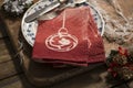 Pair of Red Folded Napkins on Plate with Christmas Decor Royalty Free Stock Photo