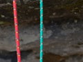 Pair of red and green climb ropes in detail. Used light rope Royalty Free Stock Photo