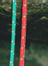 Pair of red and green climb ropes in detail. Used light rope Royalty Free Stock Photo