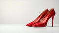 A pair of red high heels on a white surface Royalty Free Stock Photo