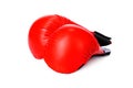 a pair of red karate gloves on a white isolated background