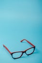 pair of red plastic-rimmed eyeglasses