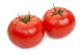 Pair of red tomatoes with drops of water isolated on white Royalty Free Stock Photo