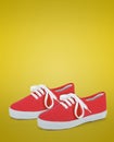 Pair of red unisex and kids sport shoes Royalty Free Stock Photo