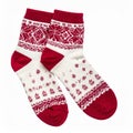 Pair of Red and White Knitted Socks with Holiday Pattern on White Background Royalty Free Stock Photo