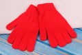 Pair of red womanly gloves and shawl for autumn or winter Royalty Free Stock Photo