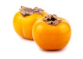 Pair of ripe japanese persimmons Royalty Free Stock Photo