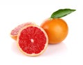 Pair ripe juicy grapefruit with green leaf Royalty Free Stock Photo