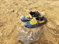 Pair of sailing boat shoes drying off on a rock