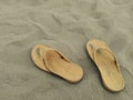 A Pair of Sandals on White Sand Beach Royalty Free Stock Photo