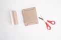 a pair of scissors sitting on top of a piece of paper, cut out of cardboard, diecut,