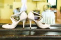 Pair of shiny white women`s shoes for a special occasion, very elegant to party with high heels Royalty Free Stock Photo