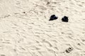 Pair of shoes on the beach Royalty Free Stock Photo